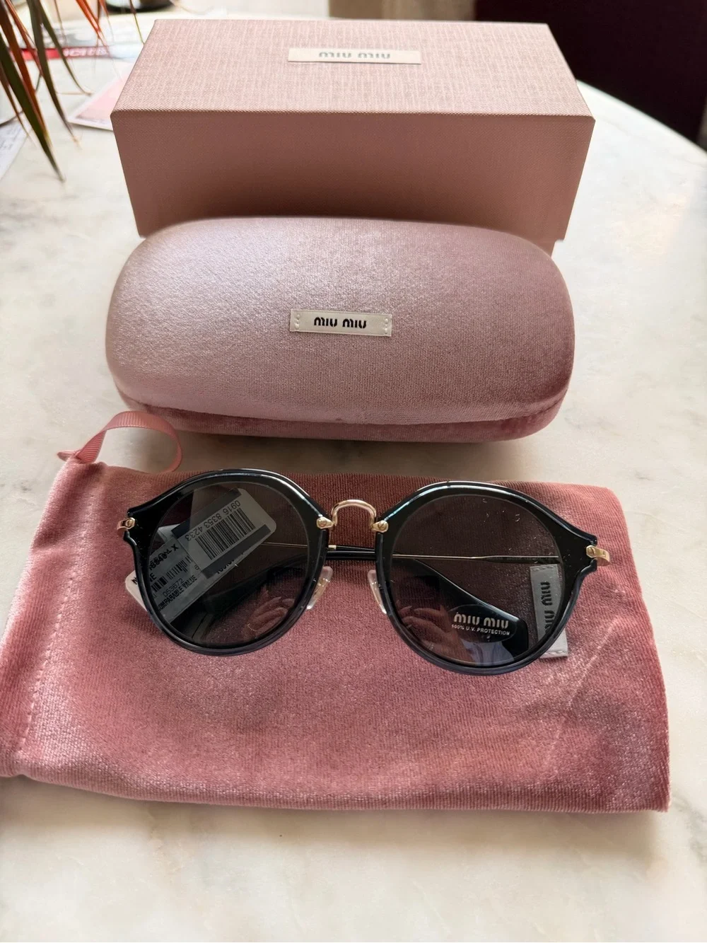 Miu Miu Round Sunglasses
